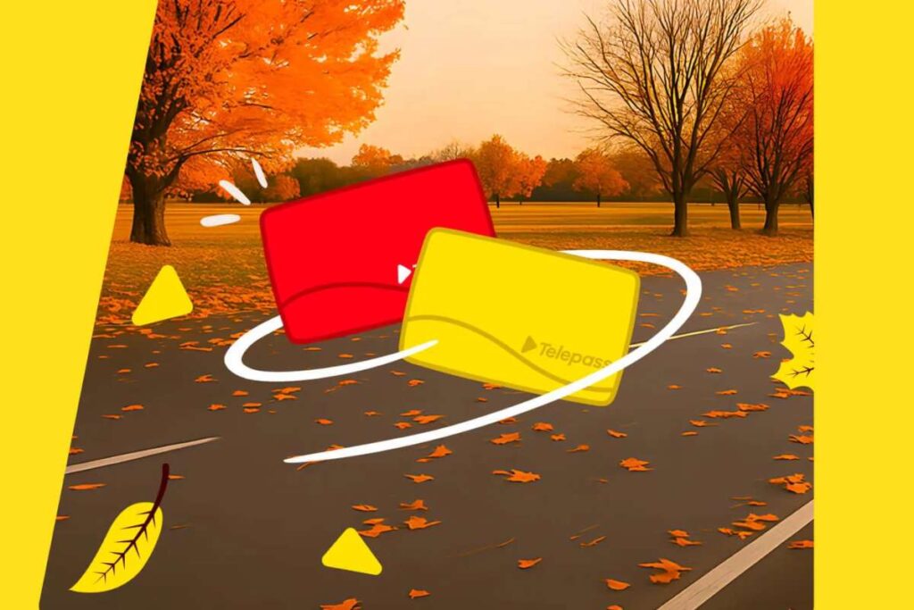 Due dispositivi telepass colorati in una strada autunnale