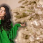 albero bianco sullo sfondo e donna che pensa