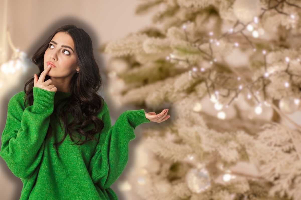 albero bianco sullo sfondo e donna che pensa 